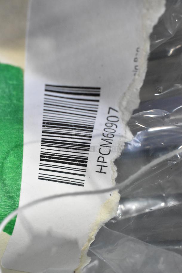 Barcode label with "HPCM60907" on new scratch and dent item packaging; includes Continental, Imperial, Turbo Air parts.