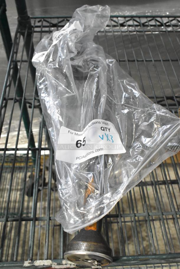 Auction item set in plastic bag, including a Continental Refrigerator CM6-0907 evaporator drain pan, Imperial 38052 burner, and Turbo Air Refrigeration 30226L0101 door handle. New condition with visible auction tag.