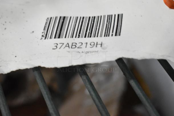 Barcoded tag labeled "37AB219H" on a metal grating surface.