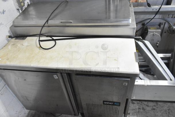 2019 Asber APTP46 commercial pizza prep table, stainless steel, on casters, 115V, 1 phase, visible wear on surface.