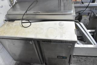 2019 Asber APTP46 commercial pizza prep table, stainless steel, on casters, 115V, 1 phase, visible wear on surface.
