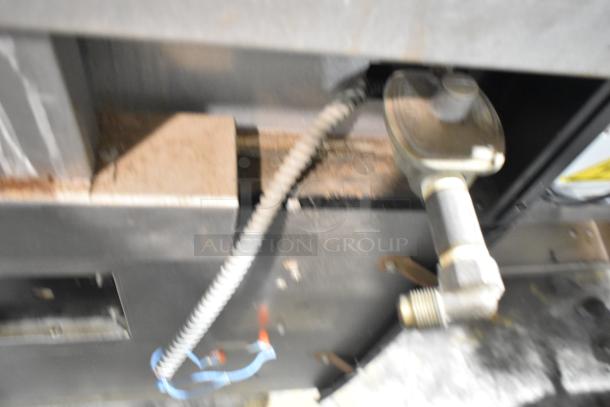 Garland Commercial Gas Griddle, 6-burner range, 2 ovens, backsplash; durable, ideal for high-volume cooking.