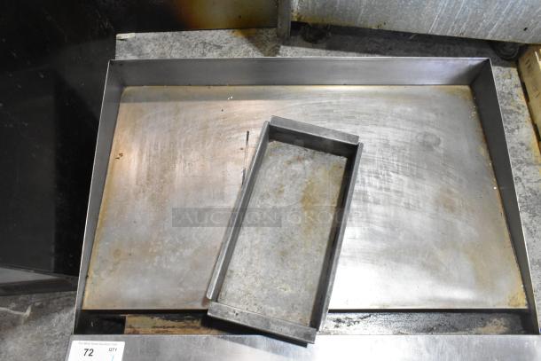 Commercial countertop gas-powered flat top griddle, stainless steel, used condition, visible surface wear.