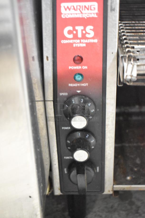 Waring CTS1000B countertop conveyor toaster oven, visible control panel, 208V, 1-phase, with speed and power dials.