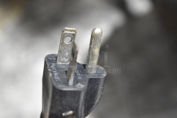 Close-up of a plug from a Waring CTS1000B countertop conveyor toaster oven, 208 volts, 1 phase.