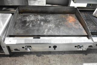 Star commercial countertop gas-powered flat top griddle with dual knobs. Visible wear and rust on the cooking surface. Item 78 tag.