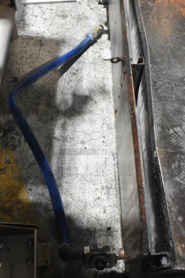 Star Commercial countertop gas-powered flat top griddle. Features a visible blue gas line. Shows signs of wear.