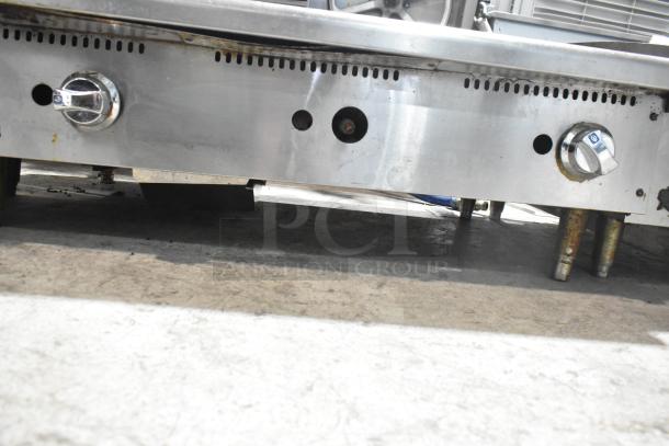 "Star Commercial Countertop Gas Griddle with dual controls, stainless steel finish, sturdy legs, in used condition."