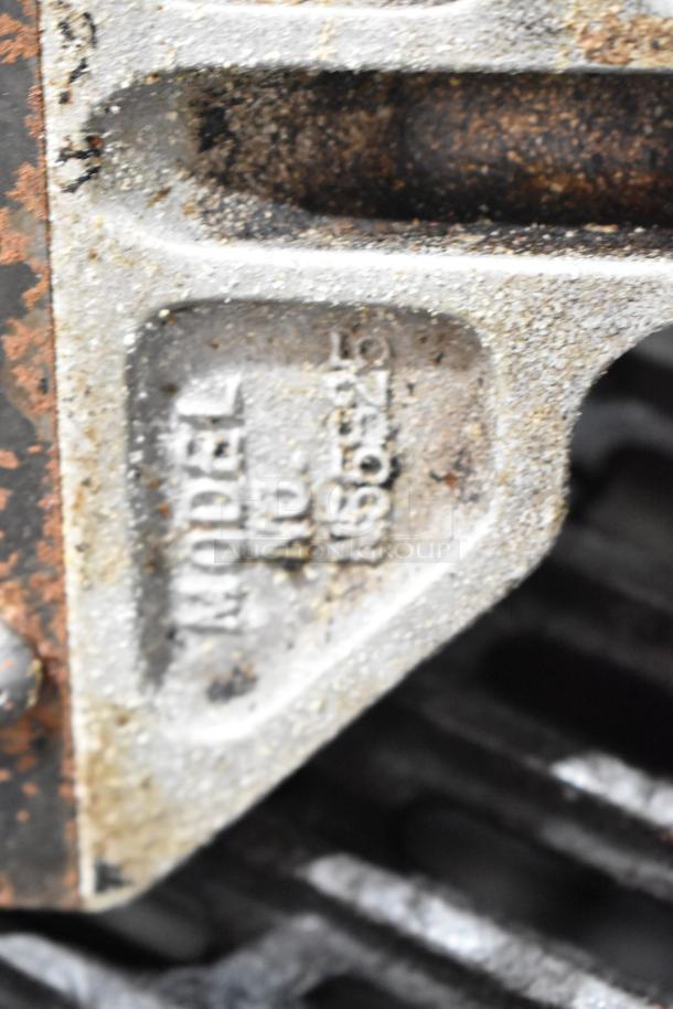 Star Max commercial gas charbroiler grill, visible model number, metal surface shows signs of wear.