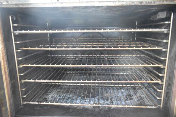 2016 Blodgett DFG-100-3 convection oven interior with multiple wire racks, showing spacious cooking capacity.