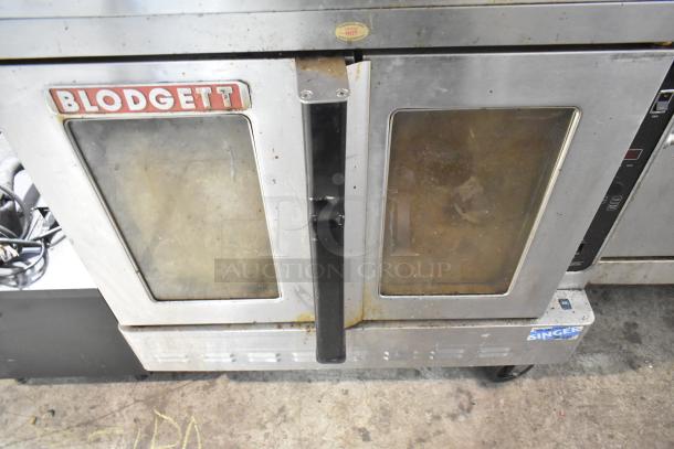 Blodgett DFG-100-3 convection oven, commercial size, view-through doors, thermostatic controls, on casters, used condition.