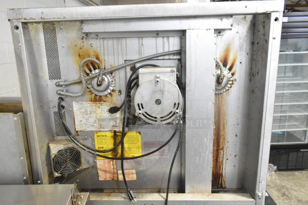 Back view of 2016 Blodgett DFG-100-3 commercial convection oven, showing electrical wiring and ventilation fan. Signs of wear visible.