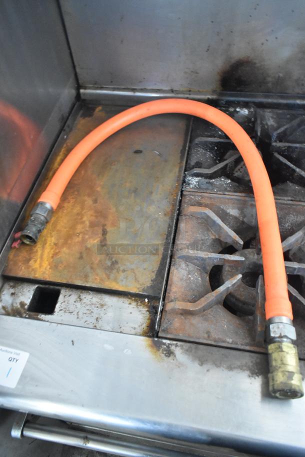 Imperial IR4-G12 commercial gas griddle with 4-burner range, oven, overshelf, backsplash on casters. Used condition.