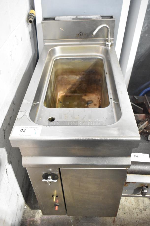 Commercial floor style pasta cooker, stainless steel, visible wear, integral faucet, auction label "83".
