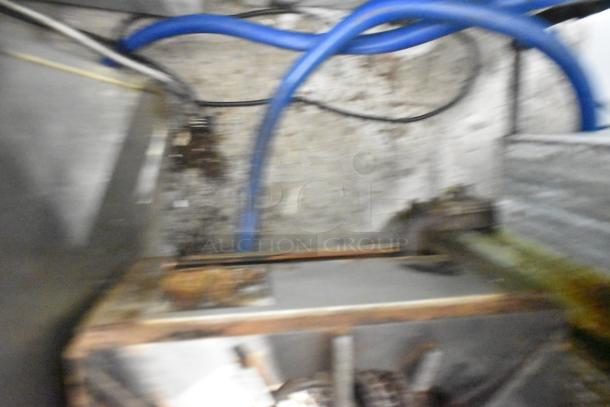 Vulcan commercial countertop gas single burner stock pot range, showing signs of usage, disconnected with visible blue gas line.