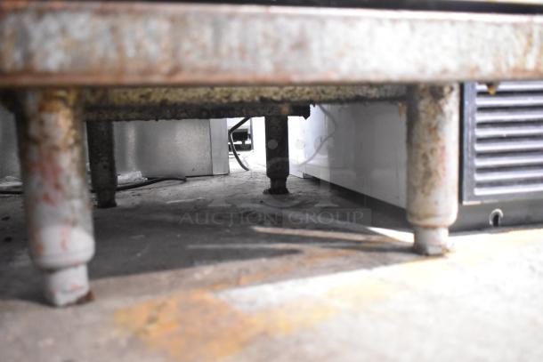 Pitco Frialator 45C deep fat fryer, floor style, natural gas-powered, 122,000 BTU; shows rust and wear on legs.