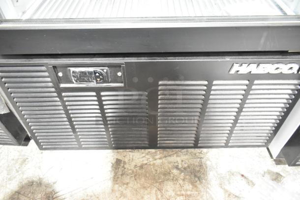 Habco SE12HC commercial single-door cooler merchandiser, 115V, 1 phase, black finish, model tag visible.