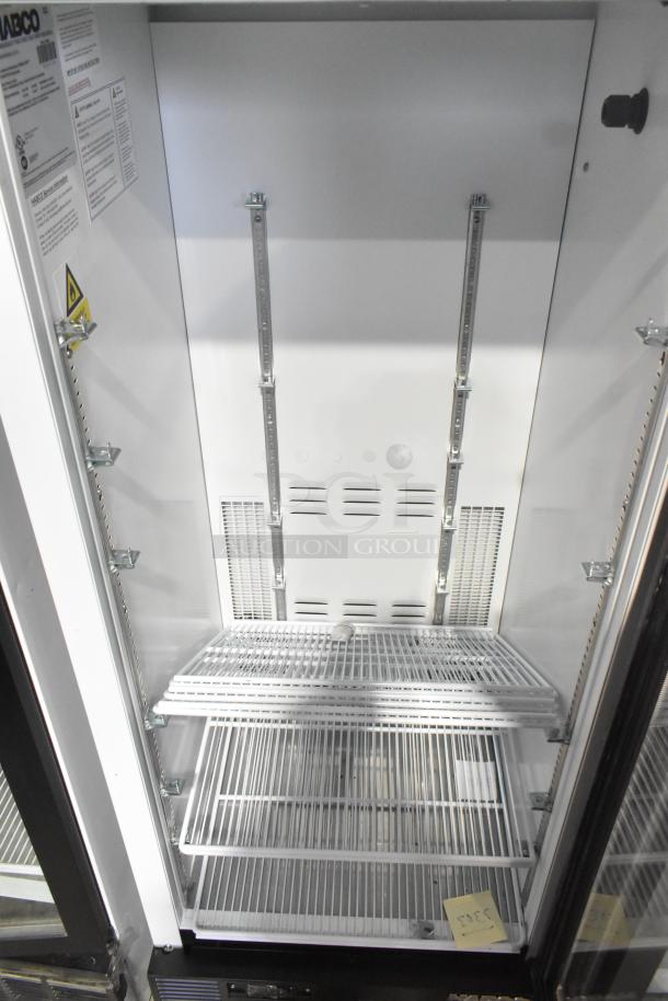 Habco SE12HC commercial single door reach-in cooler merchandiser, new condition, 115 volts, 1 phase, includes adjustable shelves.