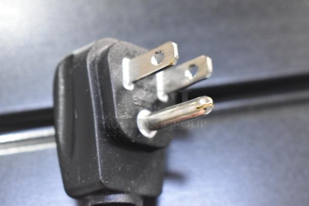 Close-up of a three-prong electrical plug for a 2019 Habco SE18HC Cooler, 115 volts, highlighting power connection.