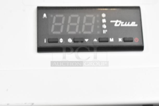 2021 True TSCI-600R-G-PH commercial cooler display panel with controls and True logo.