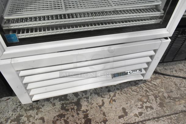 2021 True TSCI-600R-G-PH commercial single-door cooler, 115V, 1 phase, white exterior, Energy Star label visible.