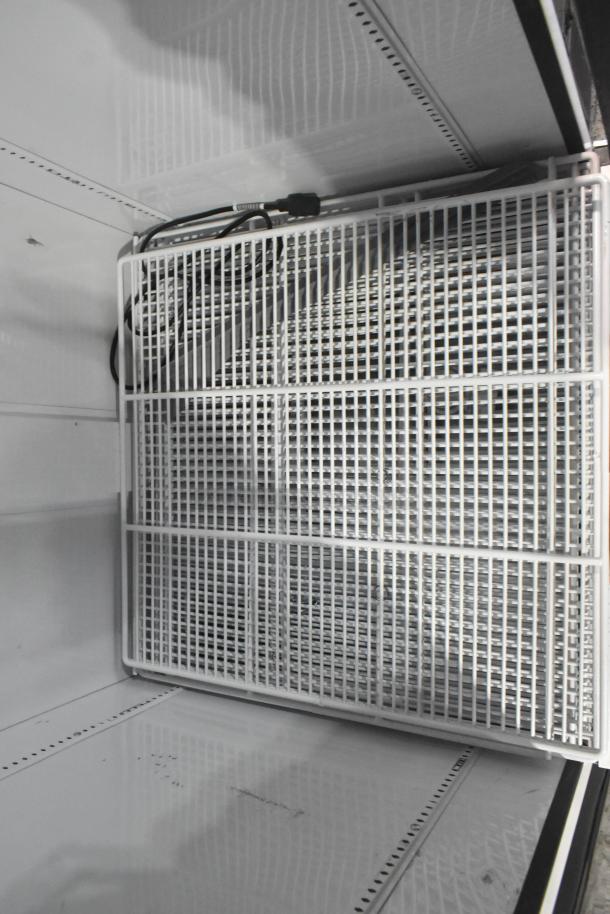 2021 True TSCI-600R-G-PH commercial cooler interior, wire shelving, sleek design, good condition, 115V, 1 phase.