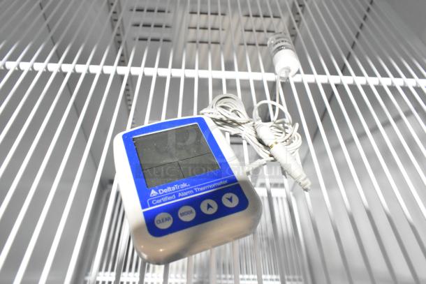 2019 Habco SE18HC cooler interior with DeltaTrak alarm thermometer on white wire shelf, pristine condition.