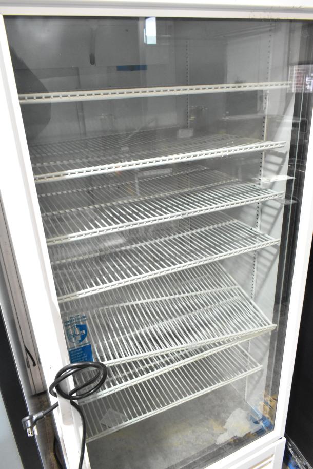 2021 True TSCI-600R-G-PH reach-in cooler, single glass door, shelves, 115V, excellent condition. Tags visible.