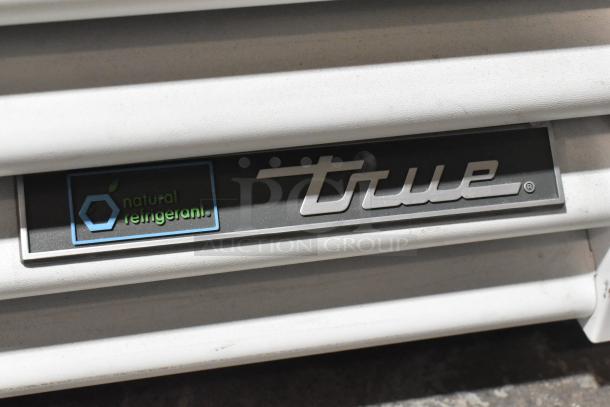 2021 True TSCI-600R-G-PH reach-in cooler with natural refrigerant label, showing brand logo. 115 volts, 1 phase.