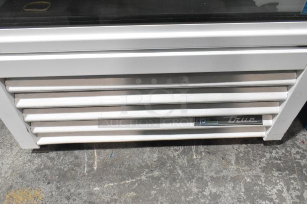 2021 True TSCI-600R-G-PH Commercial Cooler, single door, 115V, visible True logo, durable construction, good condition.