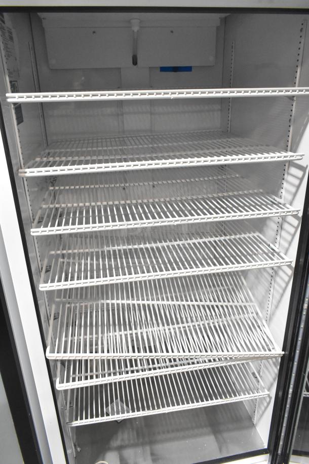 2021 True TSCI-600R-G-PH commercial single-door reach-in cooler merchandiser, 115V, 1-phase, five shelves, excellent condition.