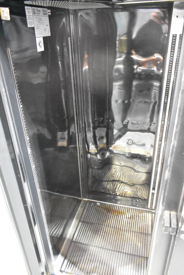 2017 True STG2RPTVLD-2G-2S-HC commercial 2-door cooler interior, stainless steel, used condition, visible model label.