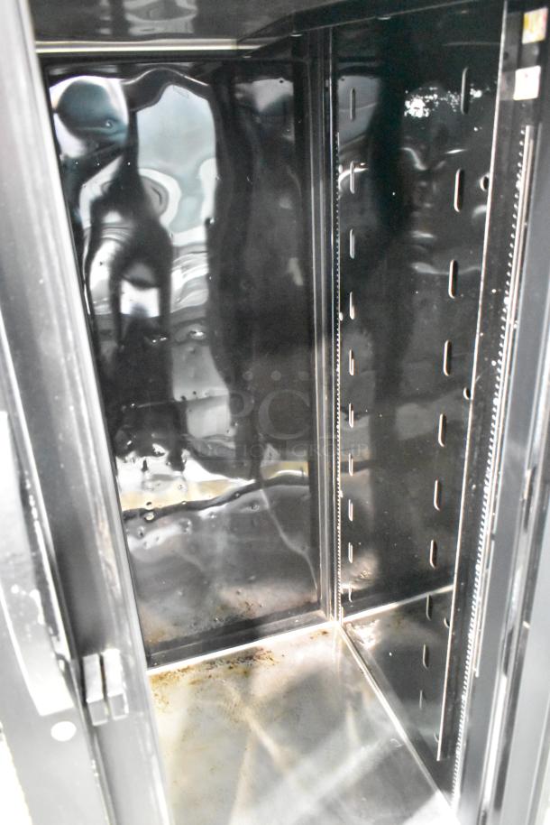 2017 True STG2RPTVLD-2G-2S-HC commercial cooler interior showing shelves, black finish, and visible wear. 115V, 1 phase.