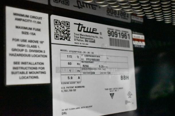 Label on True STG2RPTVLD-2G-2S-HC cooler showing model, voltage 115V, phase 1, refrigerant R290, serial number.