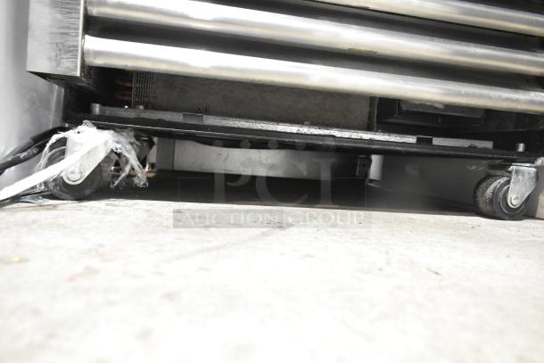 2022 True T-19F-HC commercial freezer base on casters, 115V, 1 phase; shows sturdy construction and mobility.