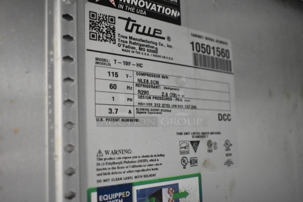 2022 True T-19F-HC commercial freezer label. Features 115V, 60Hz, R290 refrigerant. Includes model, design pressures, warnings.