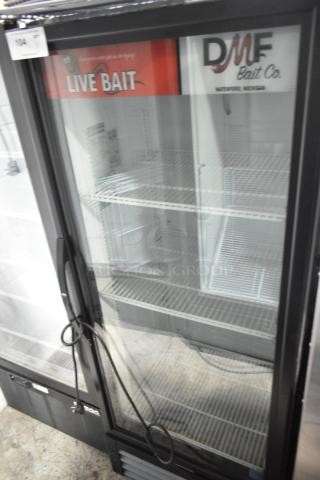 2019 True GDM-12-HC commercial single door cooler merchandiser with glass door, wire shelves, and "Live Bait" signage. 115V.