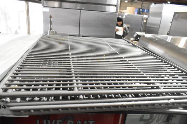 2019 True GDM-12-HC single door cooler shelf close-up, showing metal construction and good condition.