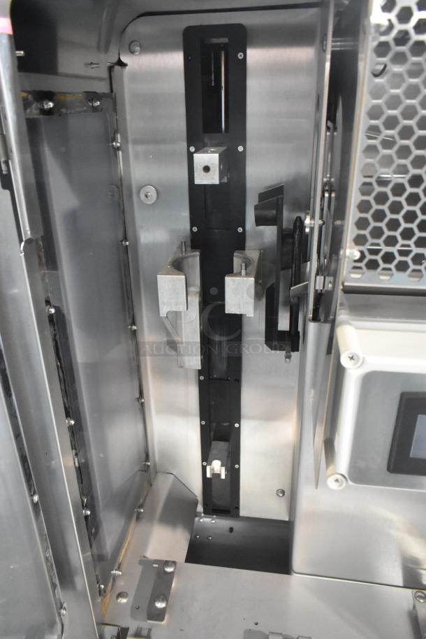 JBT Fresh N Squeeze citrus juicer interior view; stainless steel components, commercial quality, on casters, 115V, 1-phase.