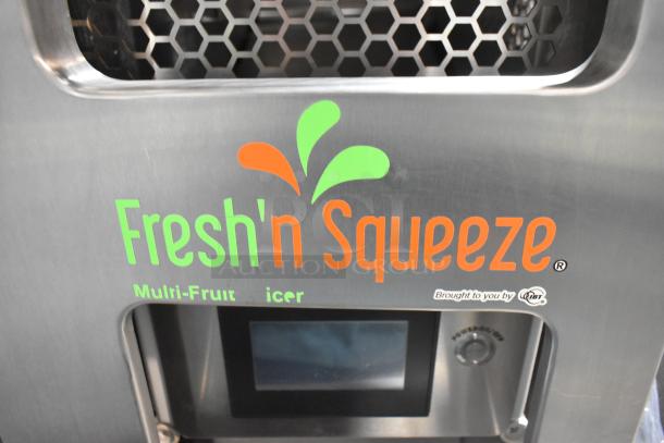 JBT Fresh N Squeeze commercial citrus juicer with digital display on commercial casters. 115V, 1 Phase.