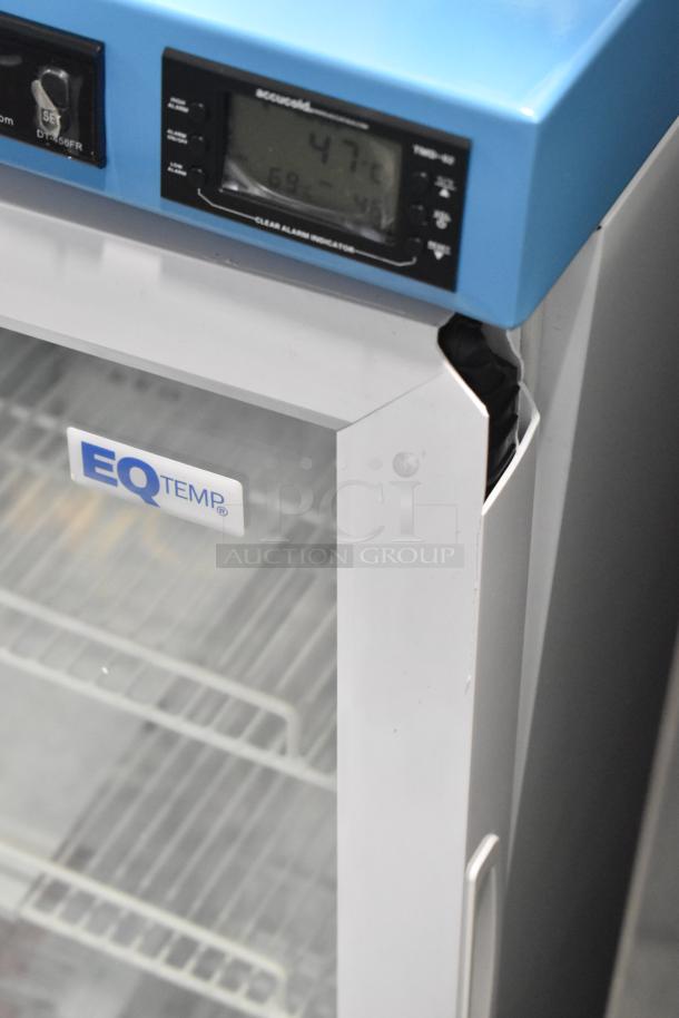 Accucold ACR32G mini cooler merchandiser with broken door. Temperature display reads 4.7°C. EQ Temp label visible. 115 Volts, 1 Phase.