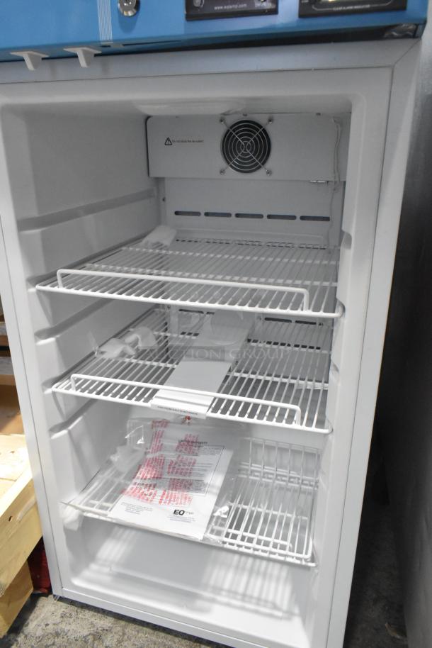 Accucold ACR32G metal mini cooler merchandiser, featuring adjustable wire shelves; visible door damage. 115 volts, 1 phase.