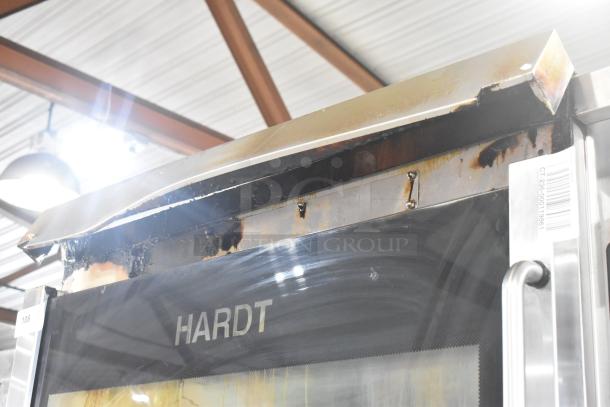 Hardt Inferno 4500 rotisserie ovens, 40 bird capacity each, visible wear, commercial casters, model label, barcode.