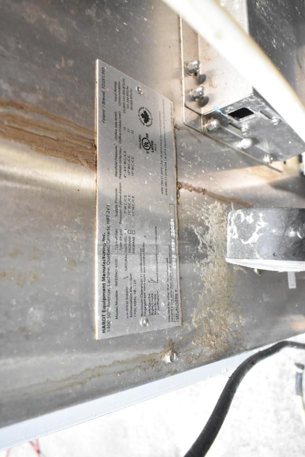 Hardt Inferno 4500 rotisserie ovens label, detailing model, natural gas 95,000-101,000 BTU capacity, mounted on casters.