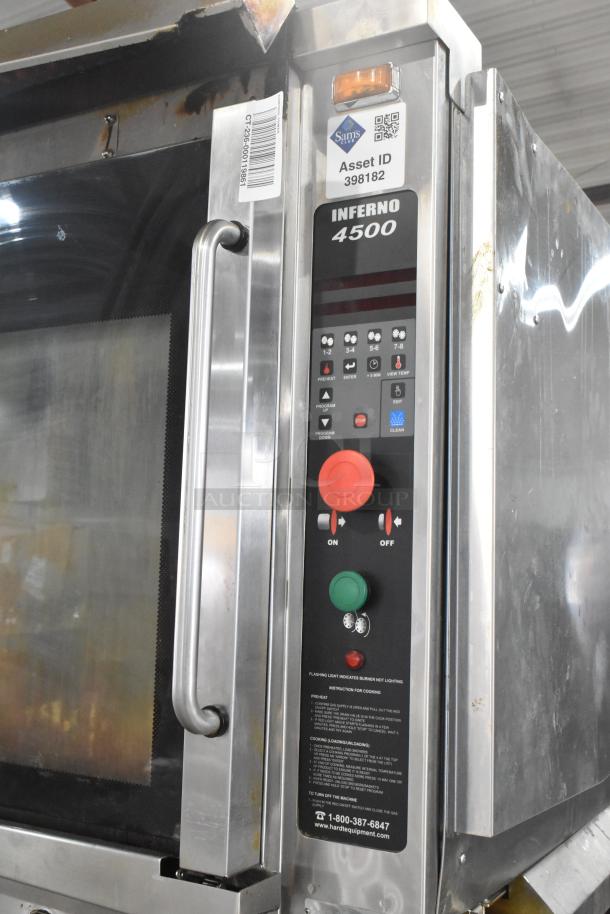 2 Hardt Inferno 4500 rotisserie ovens on casters. 40 bird capacity each, 95,000-101,000 BTU, control panel, Asset ID visible.