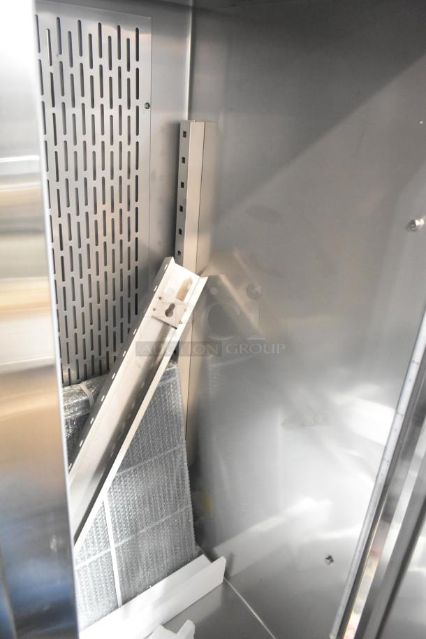 Brand new Avantco 178Z2RHC commercial 2-door cooler interior, showing scratch and dent condition, 115V, 1 phase.