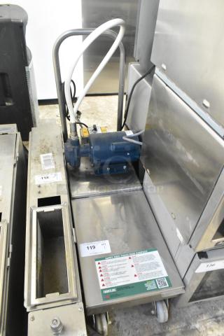 Frontline 10SS stainless steel commercial oil filtration system on casters, labels indicate safety instructions and model details.