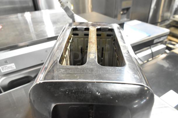 Countertop 2-slot toaster, stainless steel finish, 115 volts, 1 phase, showing signs of wear with visible slots.