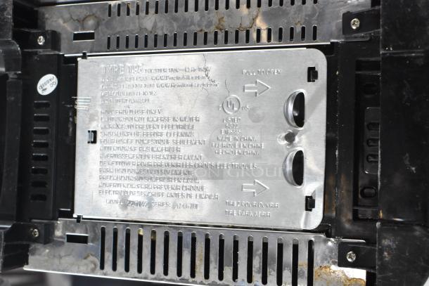 Countertop 2 Slot Toaster, Type T95, 115 Volts, 1 Phase. Metal panel with usage warnings in multiple languages.