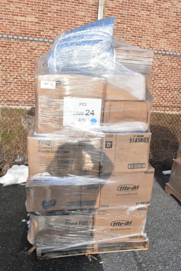 Pallet of new scratch and dent items wrapped in plastic, including take-out containers and gloves. Labeled FEB26-24.